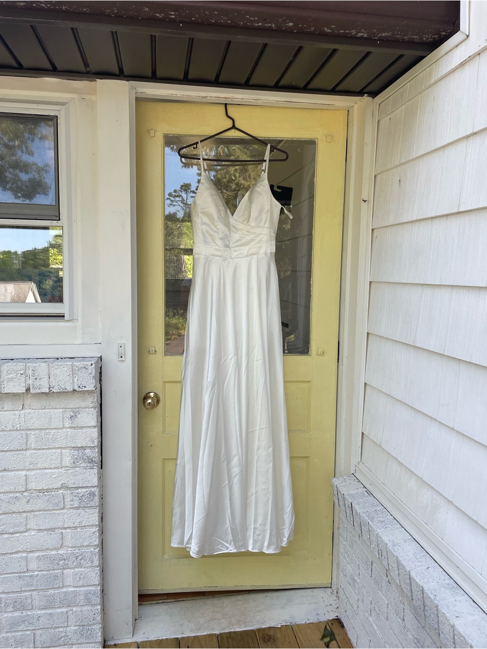 Ivory Satin V-Neck Spaghetti-Strap Wedding Dress. Tie braided back. Leg slit.